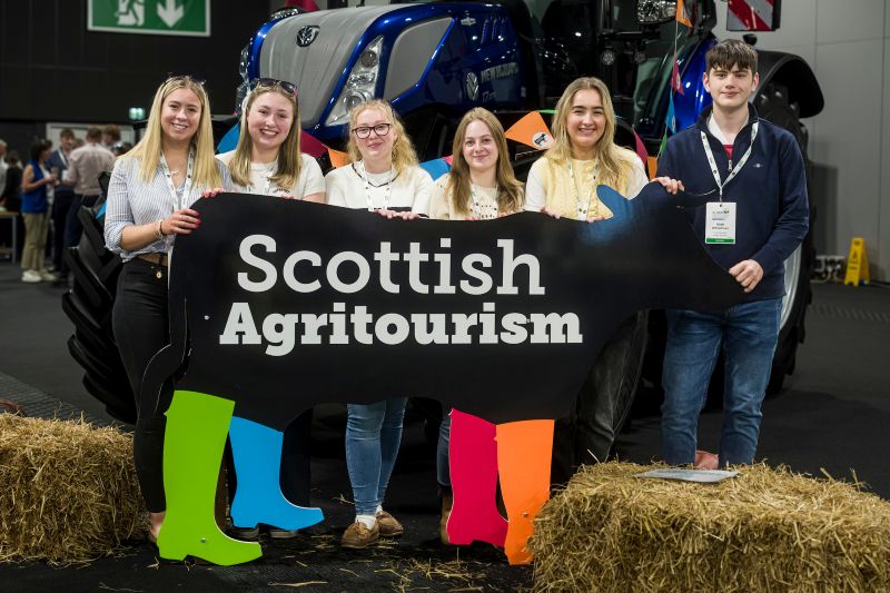 Global Agritourism Conference 2026 CalMac Young Farmers CalMac Young Farmers pose with Scottish Agritourism cow